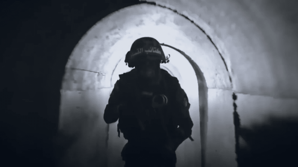 A Hamas soldier walks through one of Gaza's underground tunnels.